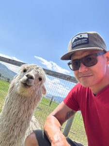 A photo of Damien with a Llama